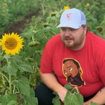 Jason's Hawaiian Holiday : Jason by a sunflower 