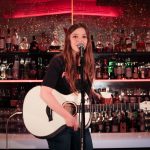 101X-Session Featuring UKTX Artist Jade Bird: Jade Bird strumming guitar and singing