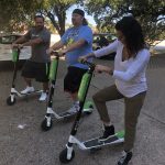 Ready To Race : Jason, Deb and Nick try out lime scooters in the Emmis Austin radio from parking lot. 