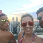 City View Pool Pics: deb and friend and niece in front of city of Singapore in the pool 