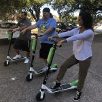 And They're Off : Jason, Deb and Nick try out lime scooters in the Emmis Austin radio from parking lot. 