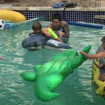 Deb Takes Alfie And Braidy To The Pool: Deb at the pool with an alligator float. 