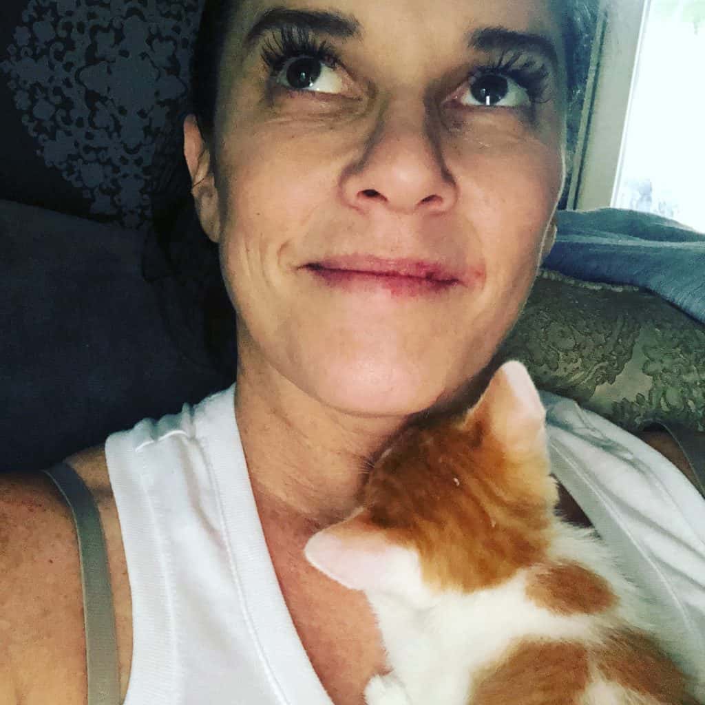 Deb Holding Her Kitten with Many Face Bruises