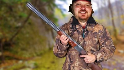 Photoshopped Image of Jason holding a rifle in a camouflage jacket