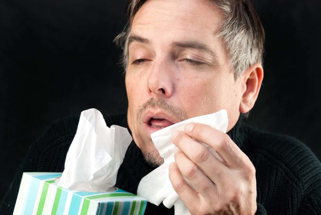 A guy pretending to sneeze.