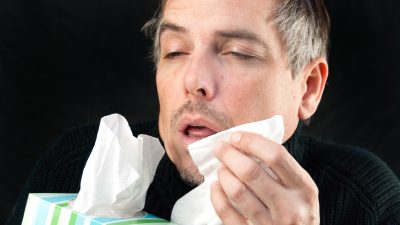 A guy pretending to sneeze.