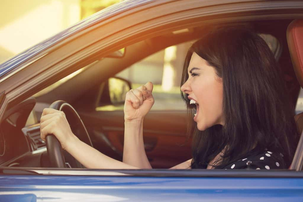 A lady in her car upset.