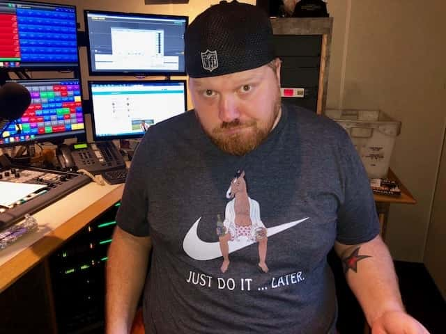 Jason wearing a shirt of BoJack Horseman in the studio.