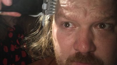 Jason getting his hair cut into a mullet.