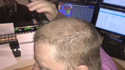 Image of Jason shaving his head in the studio