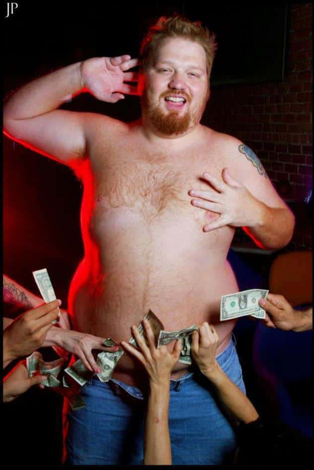 Jason shirtless with money in his pants.