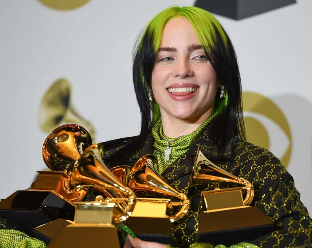Billie Eilish poses in the press room with the awards for Album Of The Year, Record Of The Year, Best New Artist, Song Of The Y