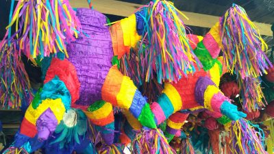 Two colorful confetti pinatas in Mexico City.