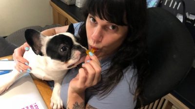 Deb eating a piece of candy.