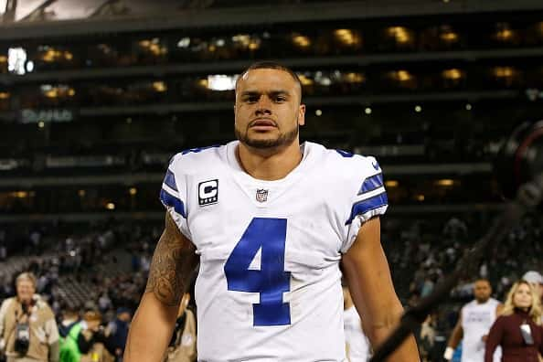 dak prescott on the field in cowboys jersey