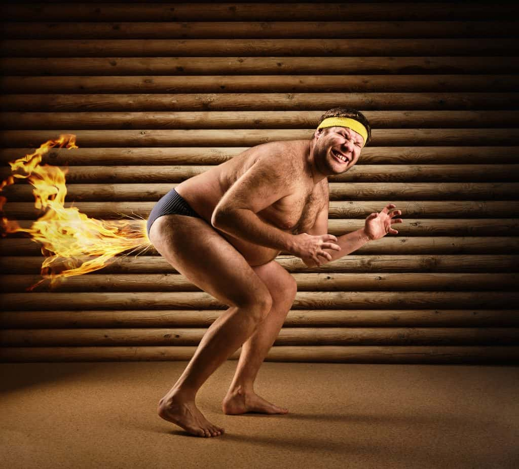 An image of a guy farting with fire coming out of his underpants