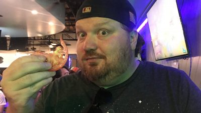 Jason holding a tomato