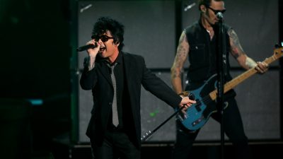 Billie Joe Armstrong, Jakob Armstrong, Joey Armstrong, Mike Dirnt, and Tre Cool of Green Day performs onstage during The Game A