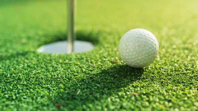 Golf Ball about to go into the holl