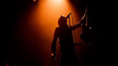 silhouette of man in red spotlight