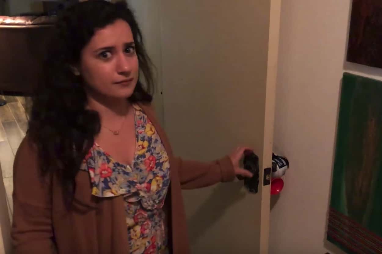 woman opening a door