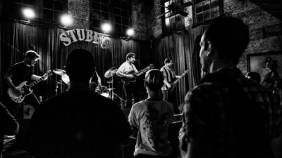 The crowd watching Otis The Destroyer at Stubb's in black and white