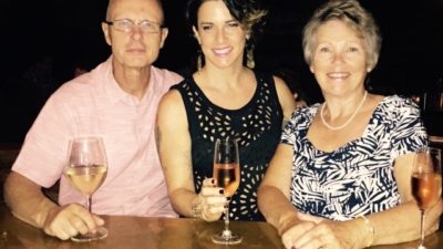 Deb drinking wine with her mum and father-in-law on her birthday