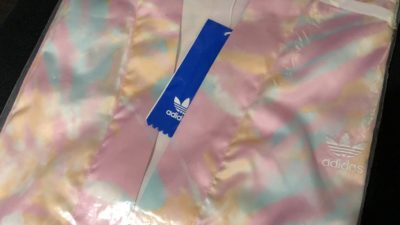 a bright pink Adidas kimono still in the bag because Deb hates it