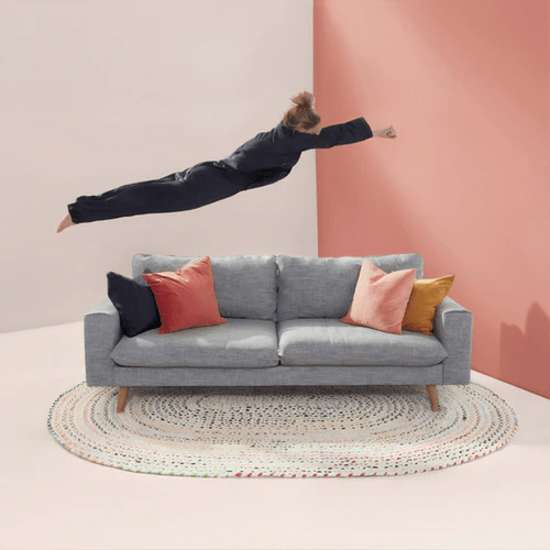 person jumping on a couch