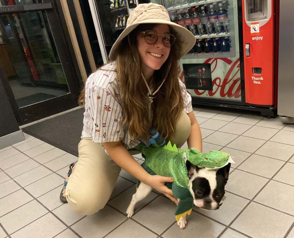 producer katy dressed up as a safari guide with alfie who is in a dinosaur costume