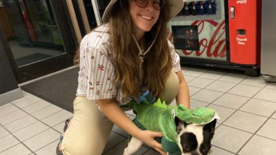 producer katy dressed up as a safari guide with alfie who is in a dinosaur costume