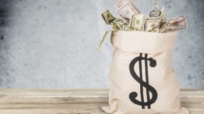 stock image of a sack full of money