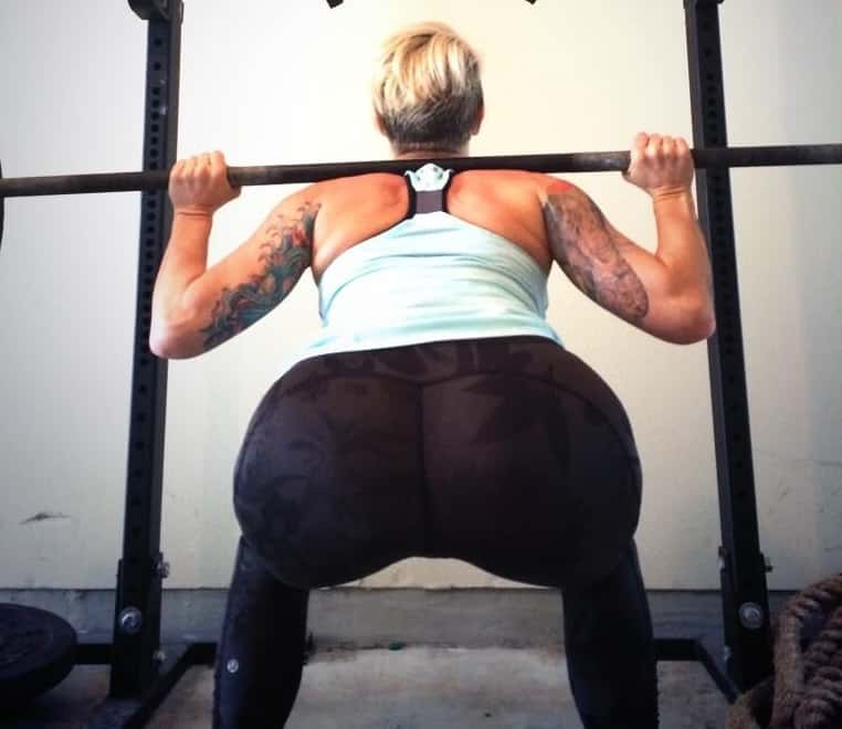 deb squatting in a gym