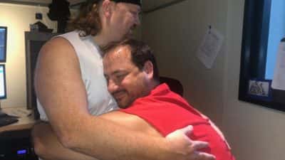 Nick and Jason having a solid bro hug in the studio