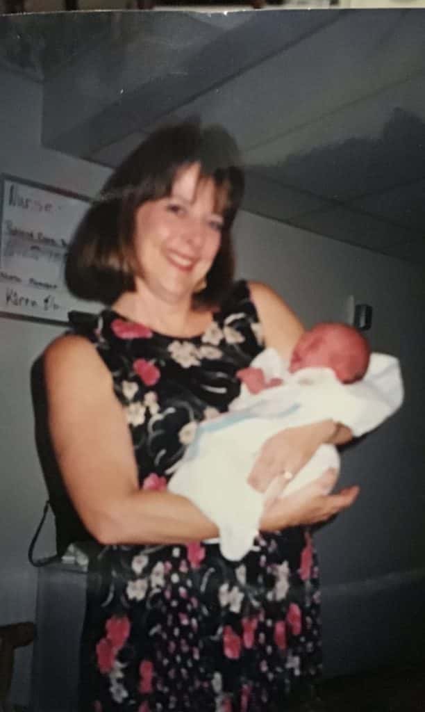 katy's mom holding her as a baby