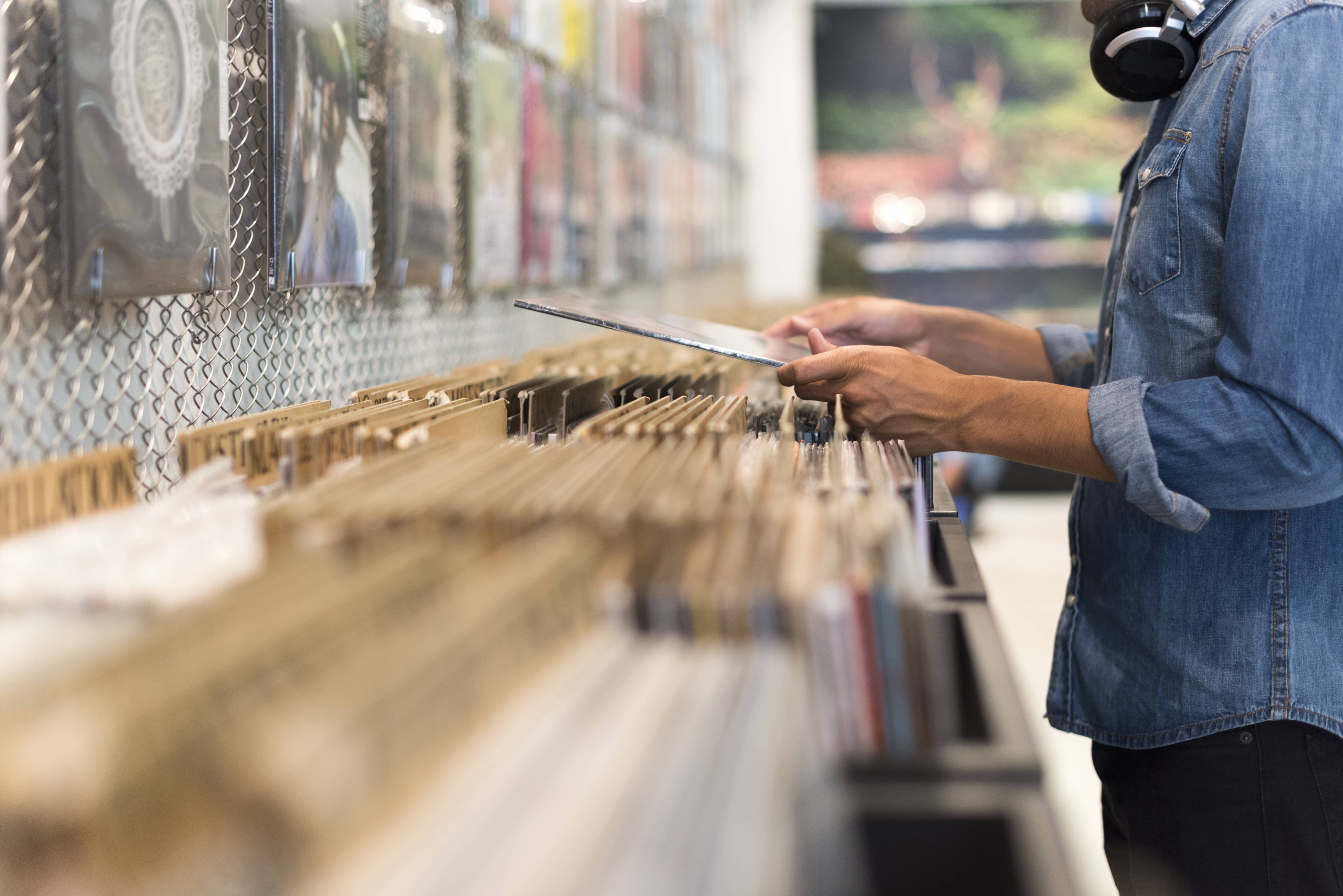 person looking at vinyl records