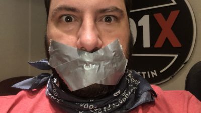 producer nick with duck tape covering his mouth
