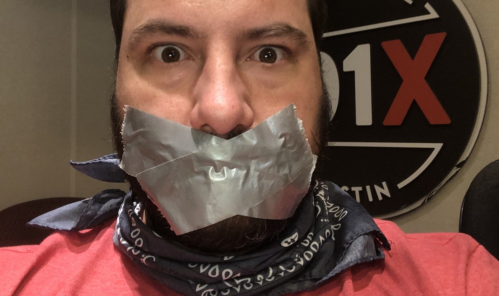 producer nick with duck tape covering his mouth