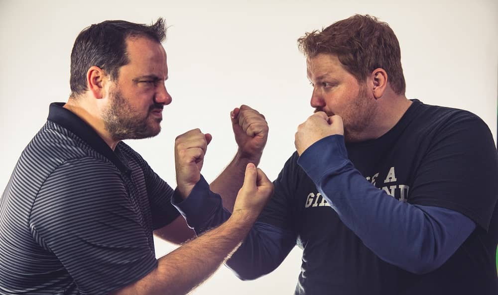 promotional photo of Jason and Nick facing off with their dukes up