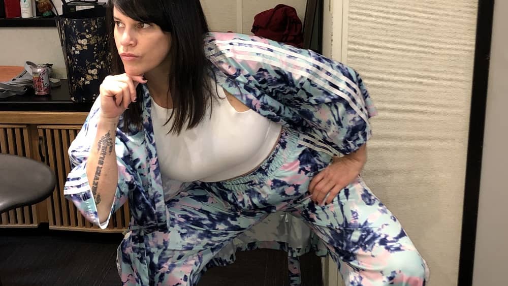 deb posing in the studio in her new adidas kimono tracksuit