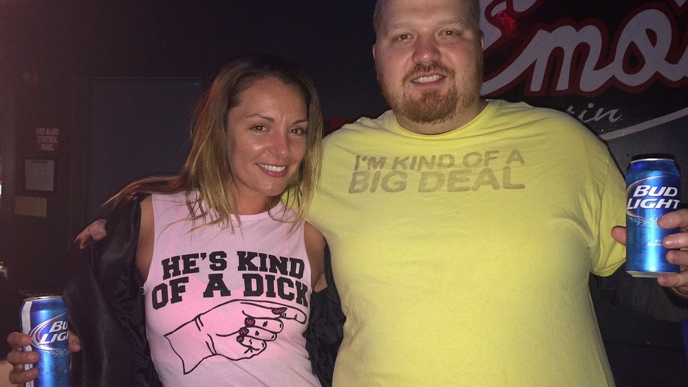 jason in a shirt that says I'm kind of a big deal, next to a hot girl with a shirt that says he's kind of a dick