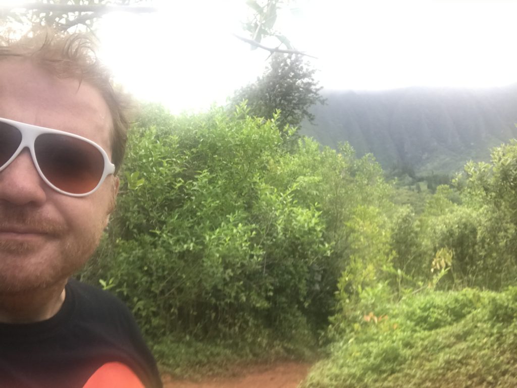 jason taking a selfie in front of some lush Hawaiian vegetation