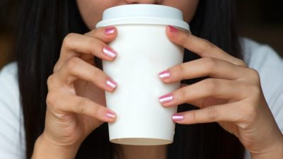 stock photo of woman slurping her coffee