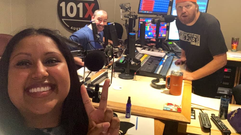 momo taking a selfie in studio with nick and jason in the background