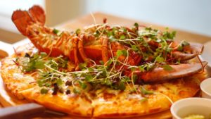 stock photo of a lobster on a pizza