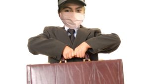 photoshop of bumblito's face on a child businessman's body