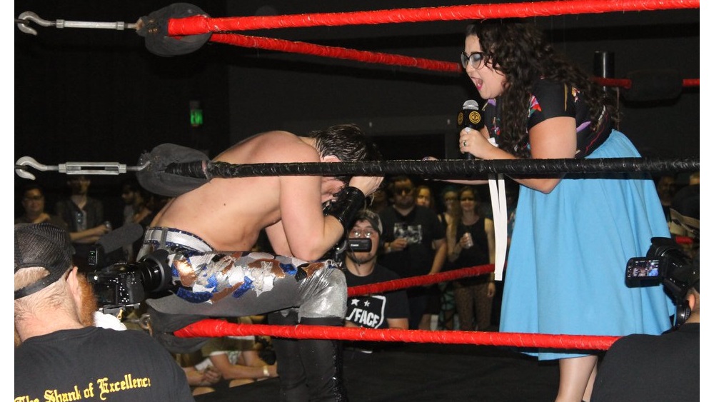 Roxy Castillo as a wrestling manager in the ring
