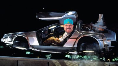 the DeLorean from back to the future with jason's face photoshopped onto Doc Brown's body