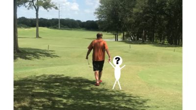 jason walking on the golf course with a bumblito-sized hole photoshopped next to him