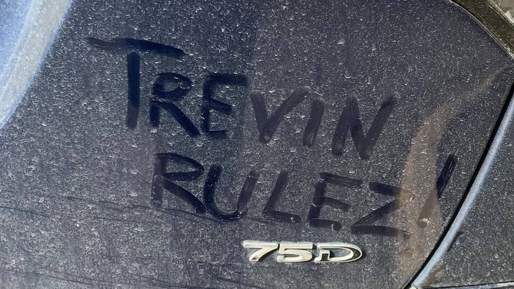 trevin rulez written in the dust on jason's tesla